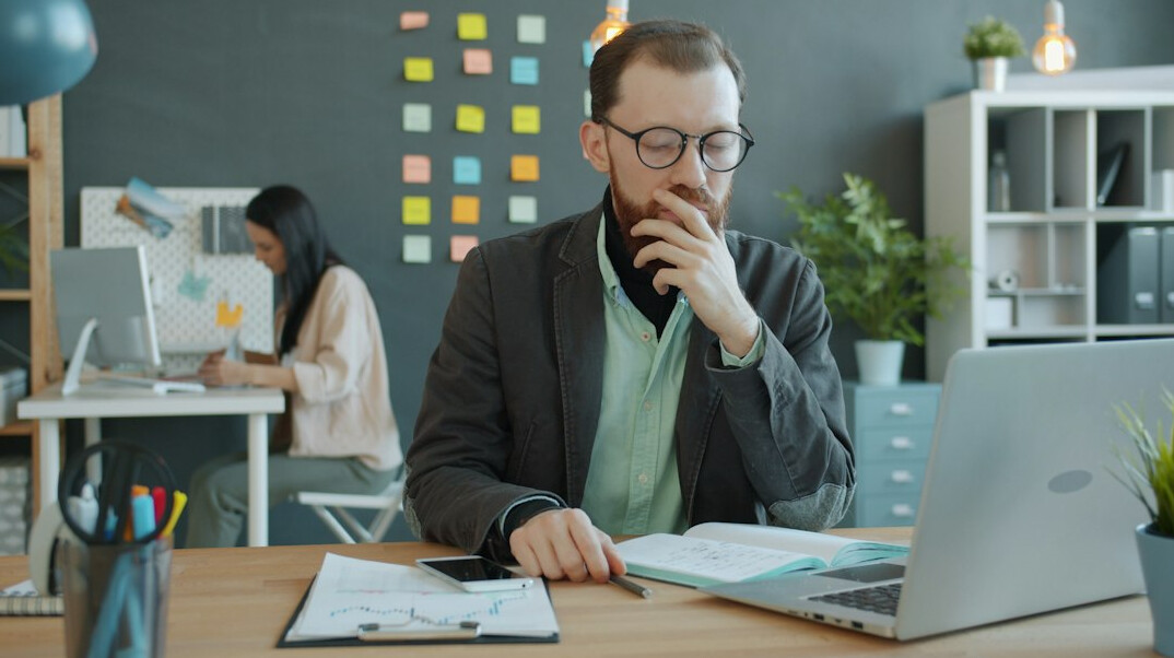 manager reflecting in office