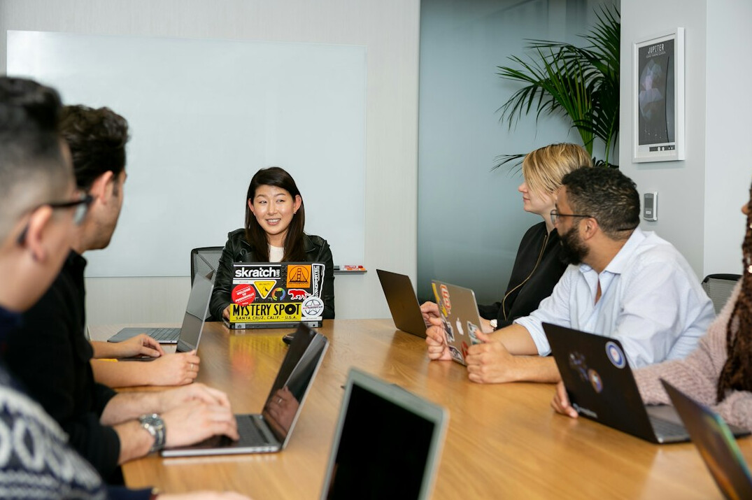 business manager leading team meeting