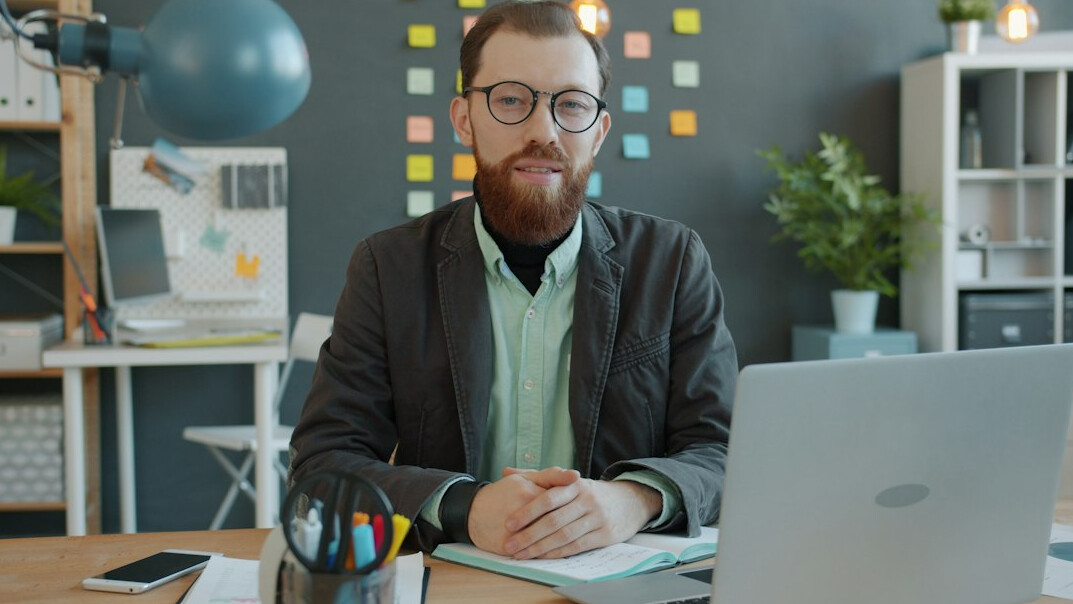 confident businessman at desk